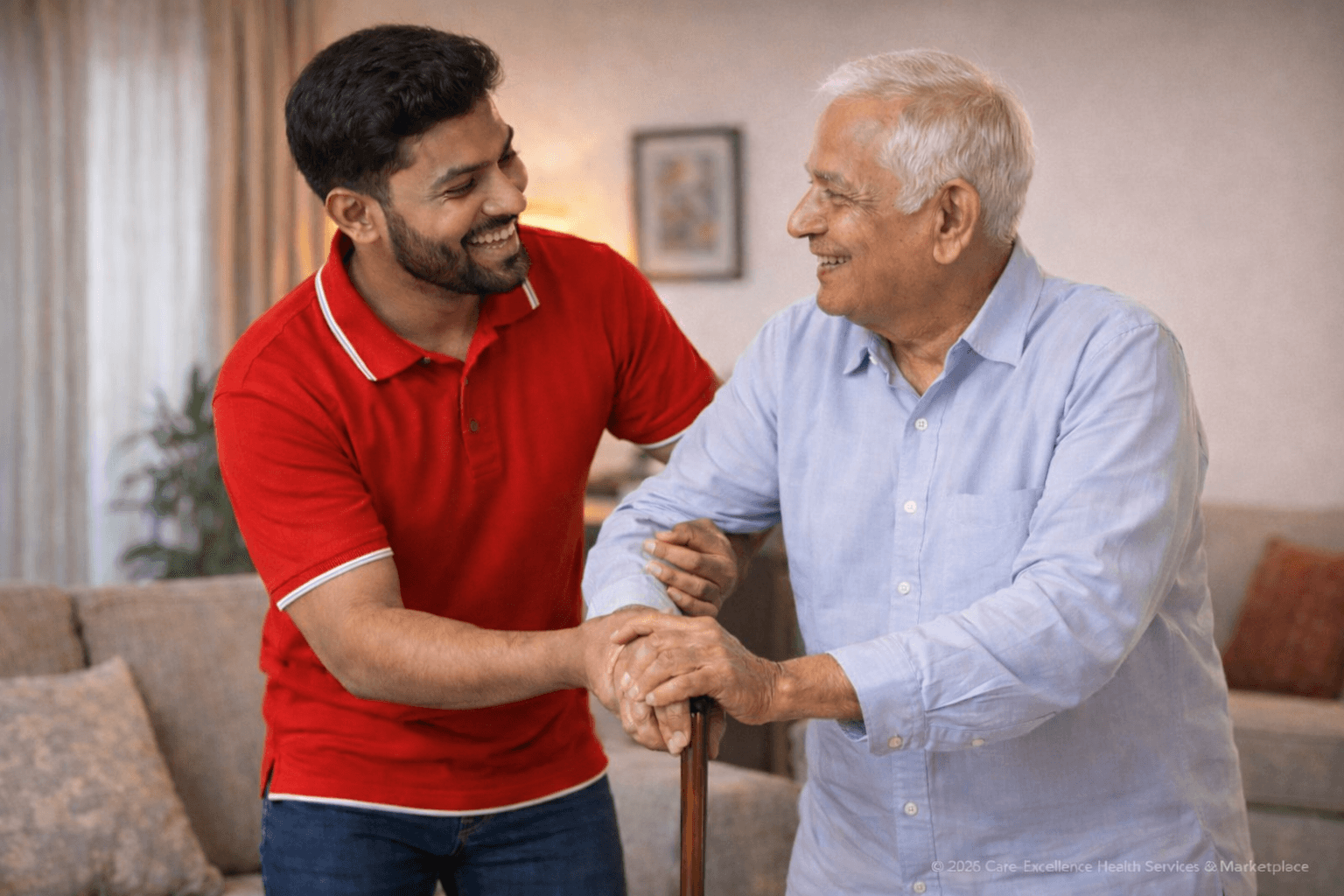 Bangladeshi male caregiver assisting an elderly man with walking support inside a home in Dhaka.